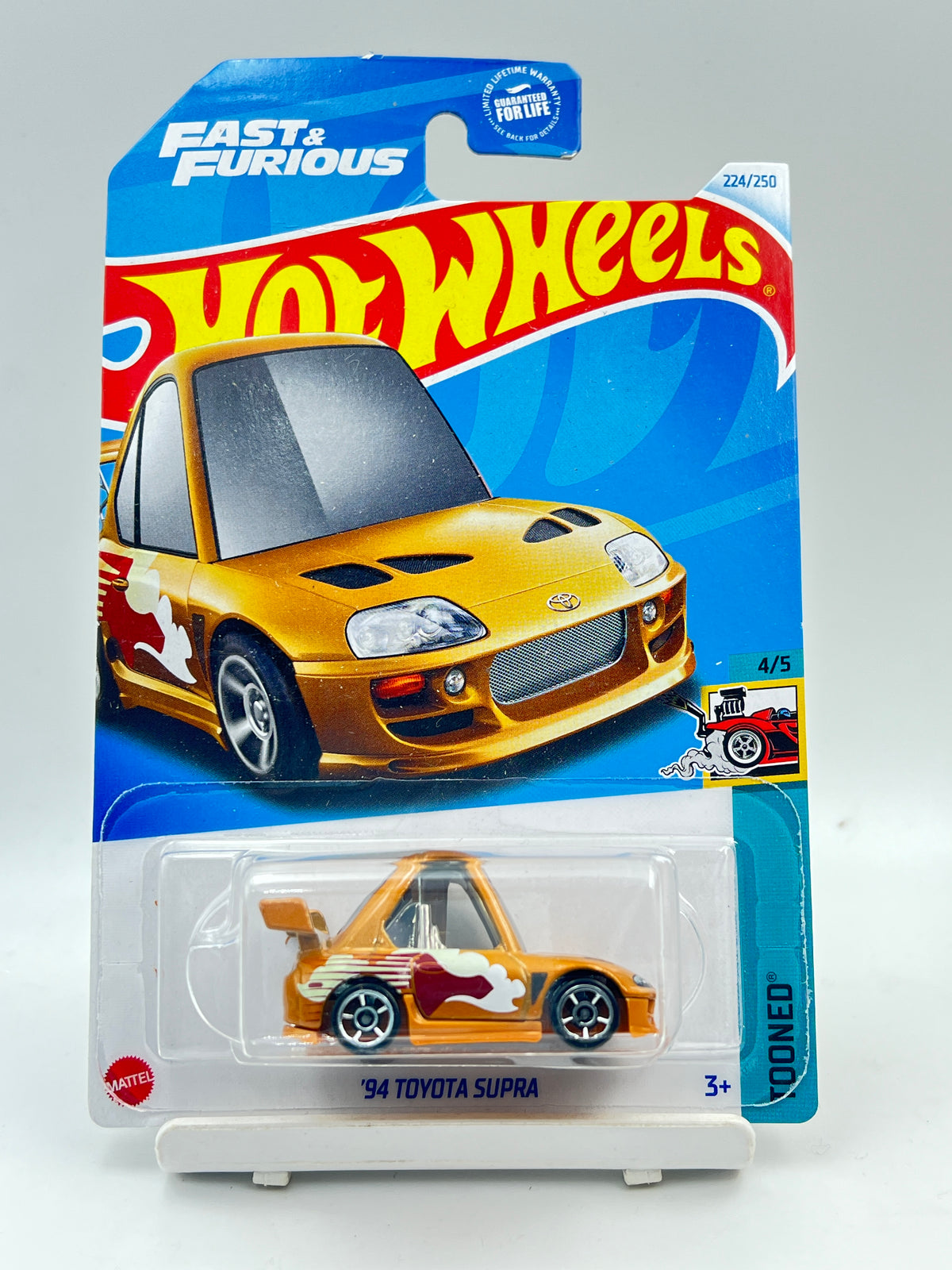 MILD CREASE - IMPORTED - HOT WHEELS - 94 TOYOTA SUPRA TOONED - 6A