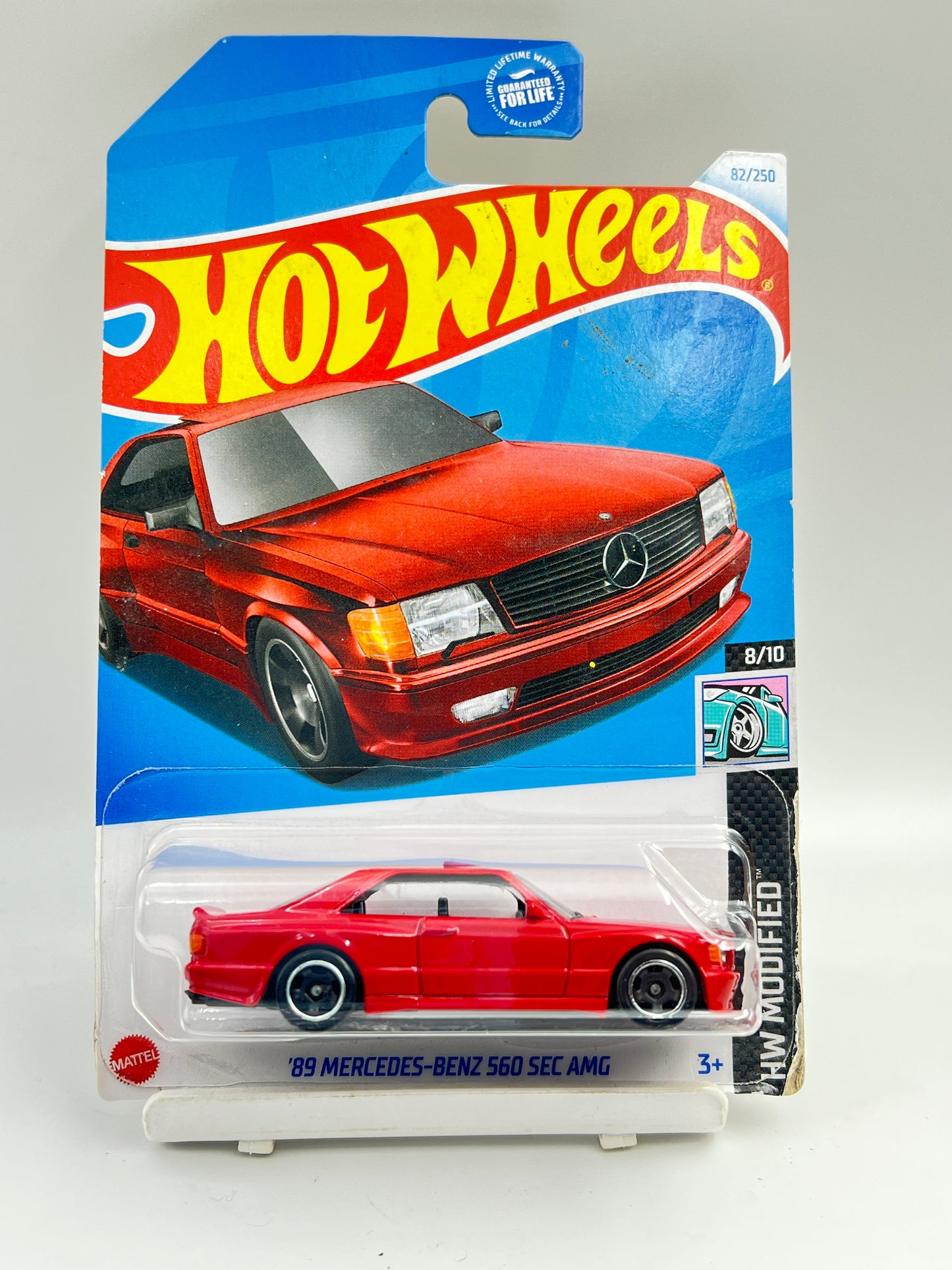( CARD AS IN PIC ) - IMPORTED - HOT WHEELS -  89 MERCEDES BENZ 560 SEC AMG - RED - 2A
