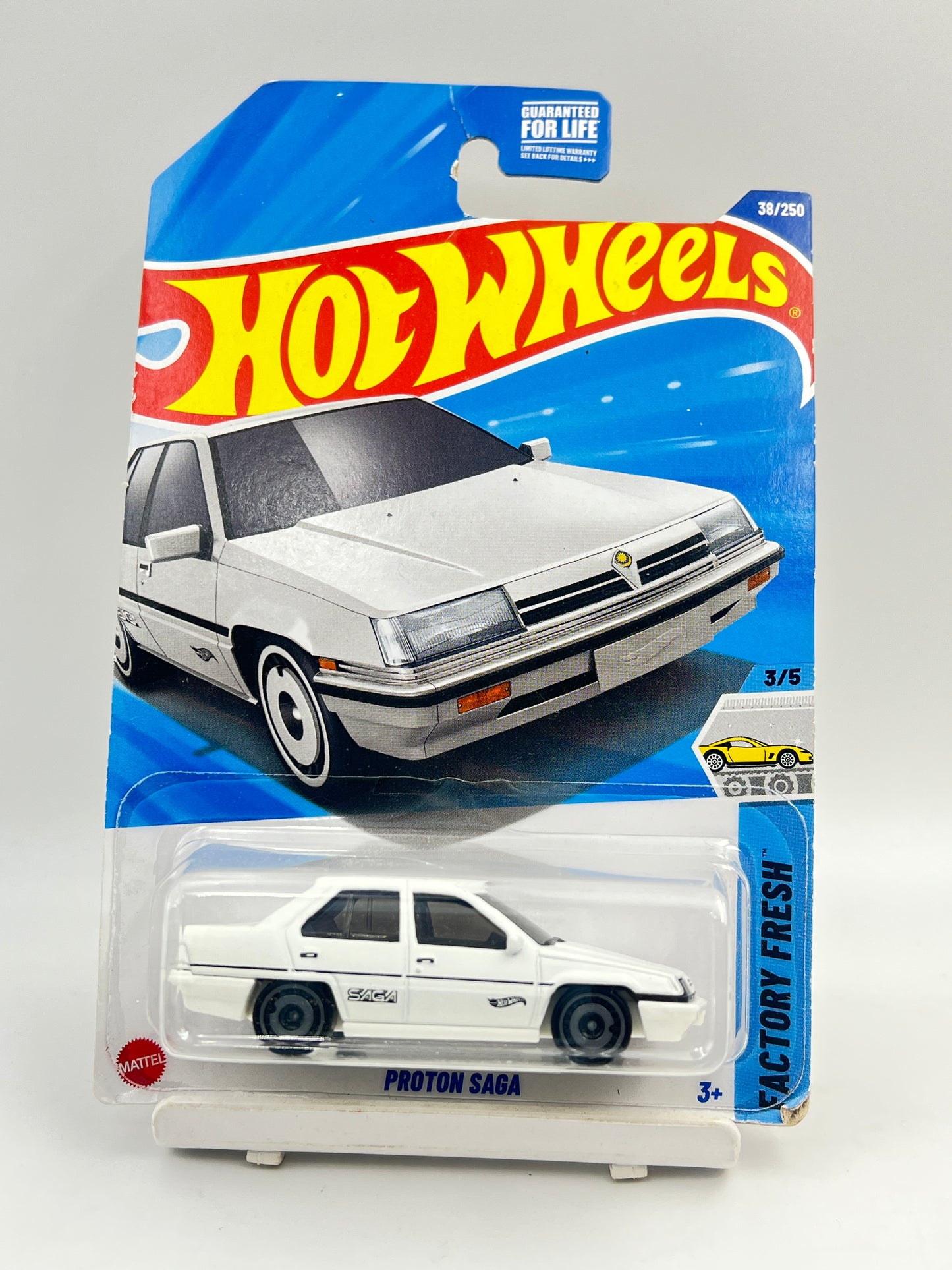 CREASED CARD - IMPORTED - HOT WHEELS -  PROTON SAGA - WHITE - 3C
