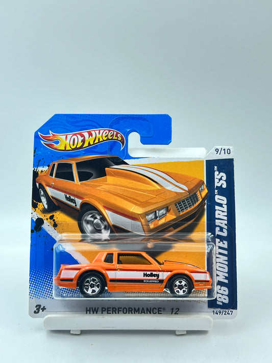 IMPORTED - HOT WHEELS -  86 MONTE CARLO SS - ORANGE SHORT CARD - 6B